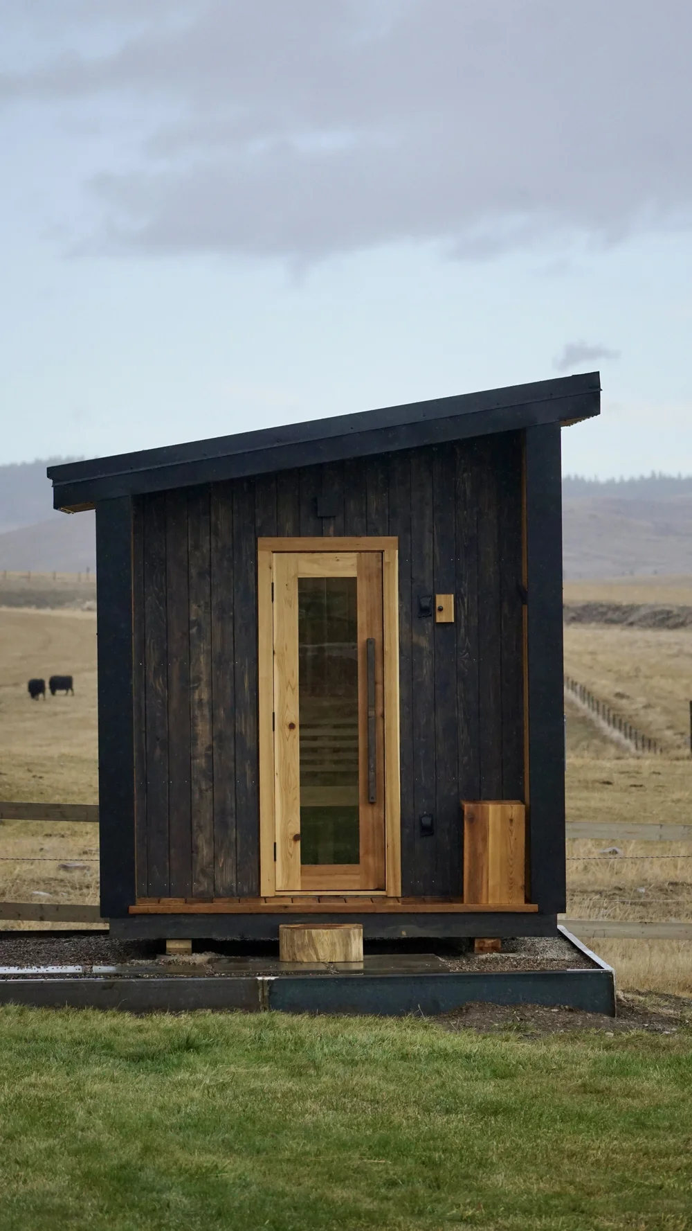 Close-up of the handbuilt cedar entry door and hardware